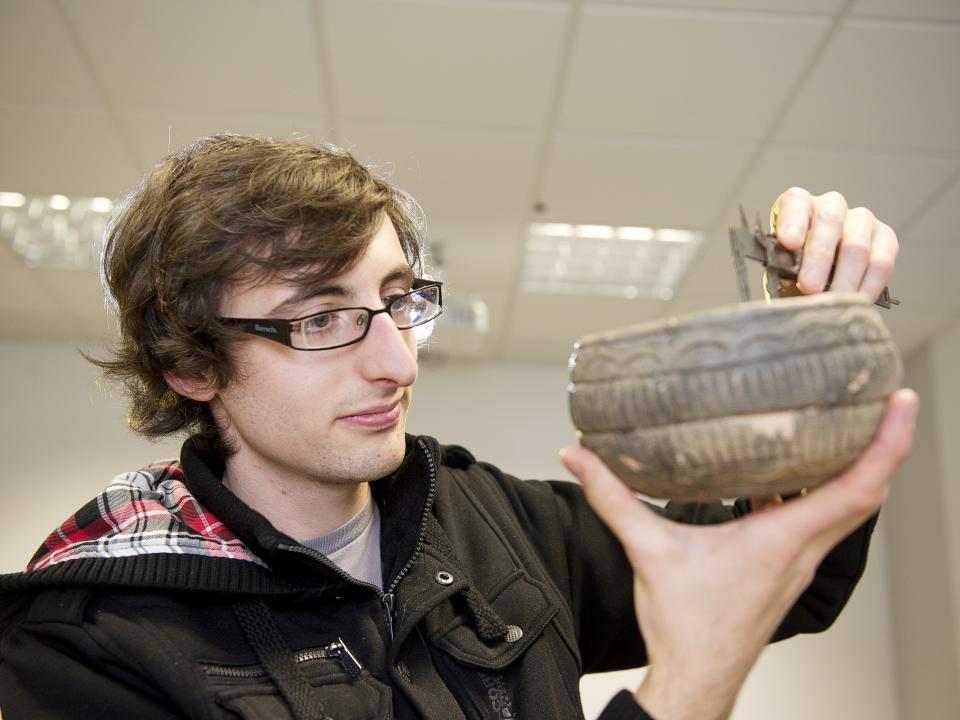 heritage-a-student-examining-a-replica-of-an-early-bronze-age-irish-bowl