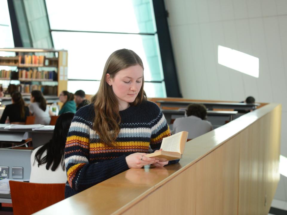 ATU Galway student reading book in library