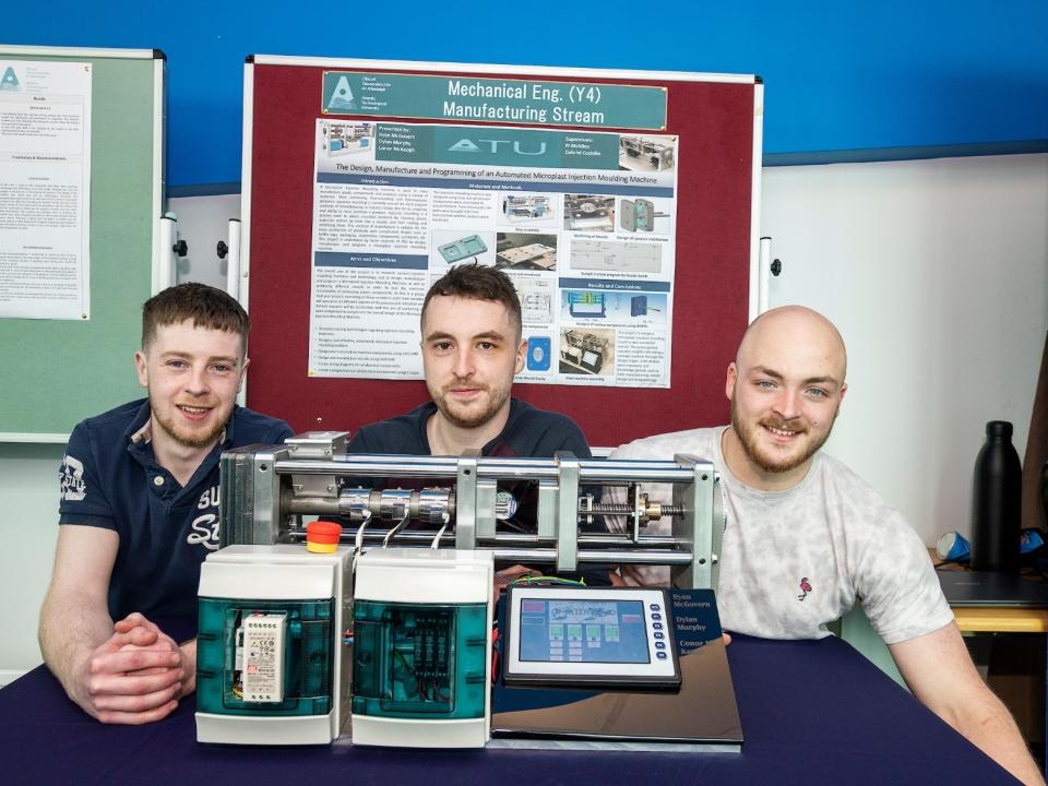 <p>ATU students Dylan Murphy, Killygarry, Co Cavan, Ryan McGovern, Clangevlin, Co Cavan and Conor McKeogh, Raherney, Co Westmeath, demonstrating the working of their miniature injection moulding machine, winning the Mechanical Engineering - Manufacturing specialisation category.</p>
