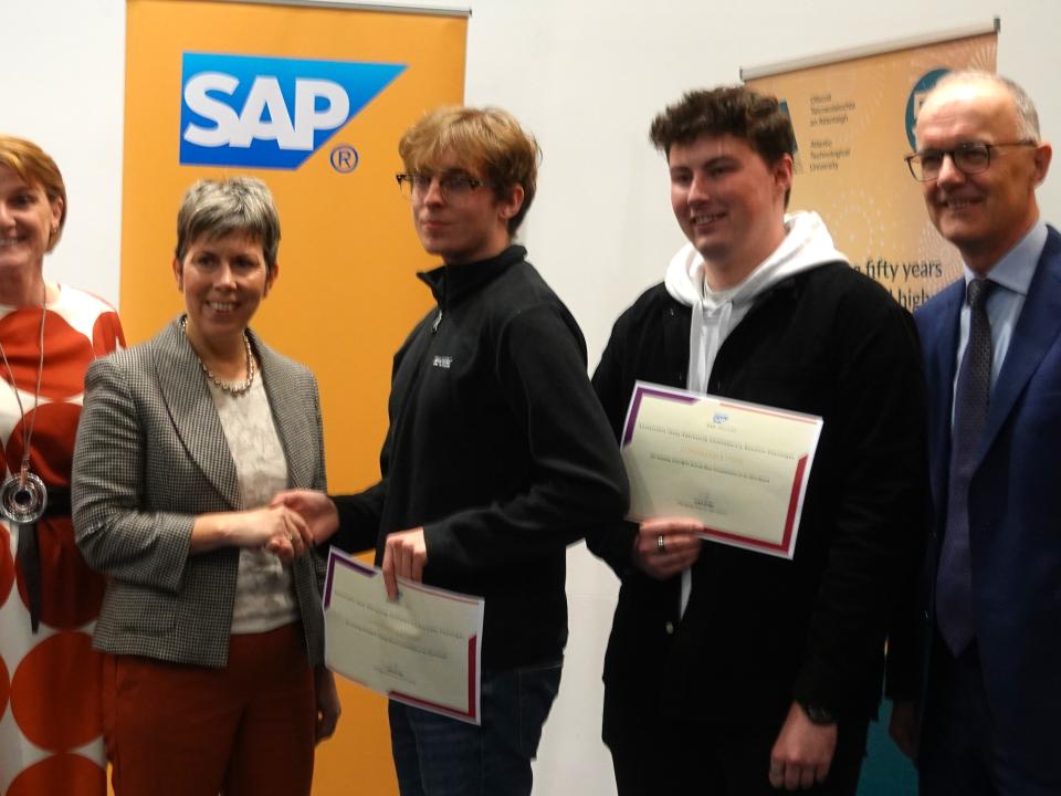 <p>Winners of the Best Overall Presentation of an Idea award, L to R: Saul O’Brien, Lismore, Co Waterford and Ryan O’Keeffe, Mitchelstown, Co Cork, pictured with Dr Breda Kenny, MTU Cork Head of School of Business, Dr Orla Flynn, ATU President, and Liam Ryan, MD SAP Labs Ireland.<br />
 </p>
